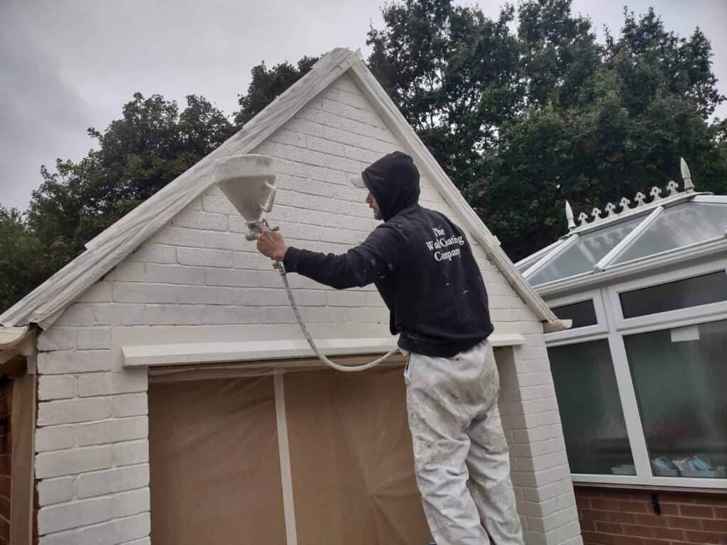 Spraying-wall-coating-to-gable-end-wall