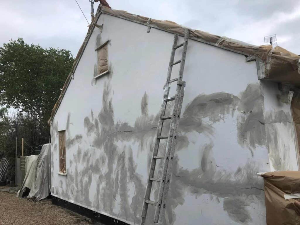 large-gable-end-with-many-repaired-render-cracks